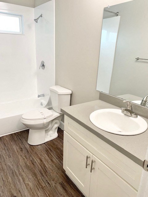 a bathroom with a toilet and a sink and a mirror