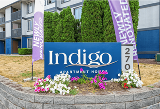 an image of the indigo apartment homes sign in front of the building