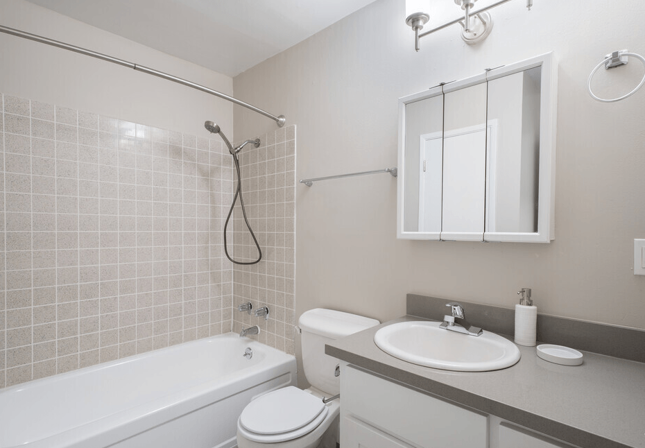 a bathroom with a sink toilet and bathtub