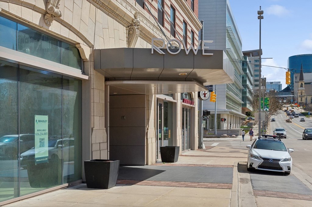a car parked in front of a hotel on a city street at The Rowe, Grand Rapids, 49503