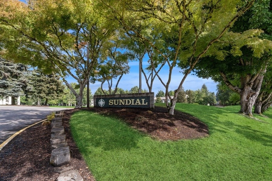 a sign for the apartments at Sundial Apartments, Wilsonvile