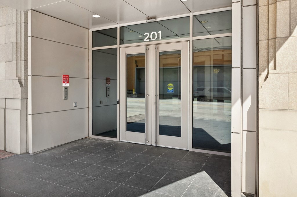 front doors of a building with the number 2100 on it at The Rowe, Grand Rapids, 49503