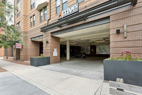 a large brick building with an entrance and a sign on the side