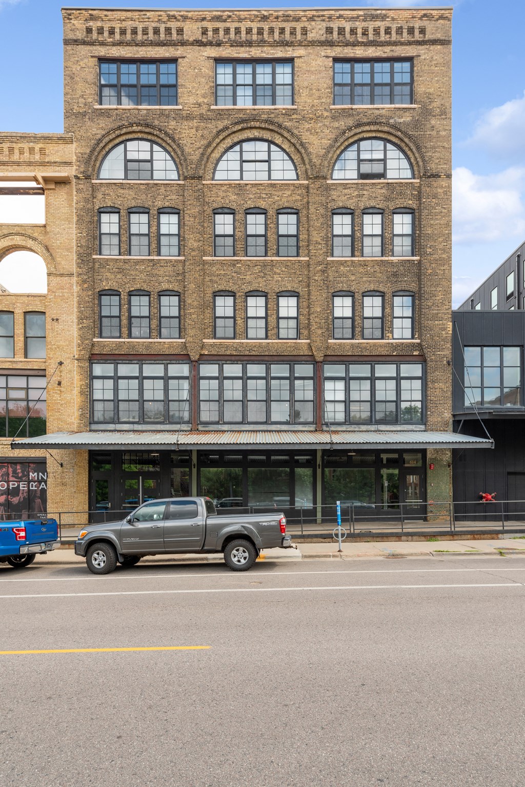 a large brick building with a truck parked in front of it at Gaar Scott Historic Lofts, Minneapolis, Minnesota