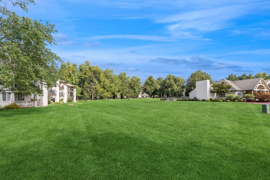 a large green lawn in front of apartments at Sundial Apartments, Wilsonvile, Oregon