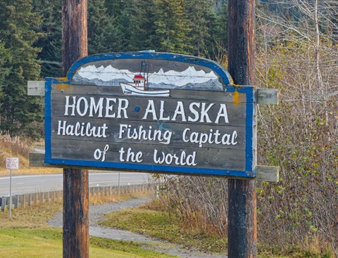 A sign that says Homer Alaska Halibut Fishing Capital of the World.