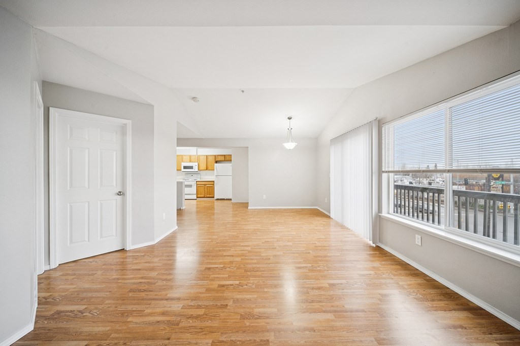 A room with wooden floors and white walls.