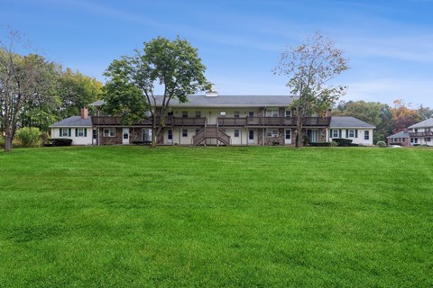 View of Stonebridge apartment building with beautiful landscape at Stonebridge, Ellington, Connecticut