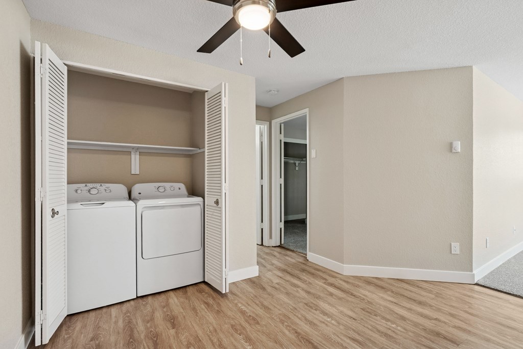 A laundry room with a washer and dryer in it.