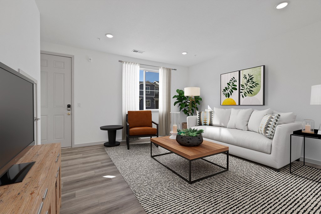 a living room with a white couch and a coffee table  at Arrive Longmont, Longmont, Colorado