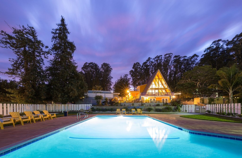 pool view with the main cabin in the background at Salinas Sunset Apartments, Salinas, CA, 93907