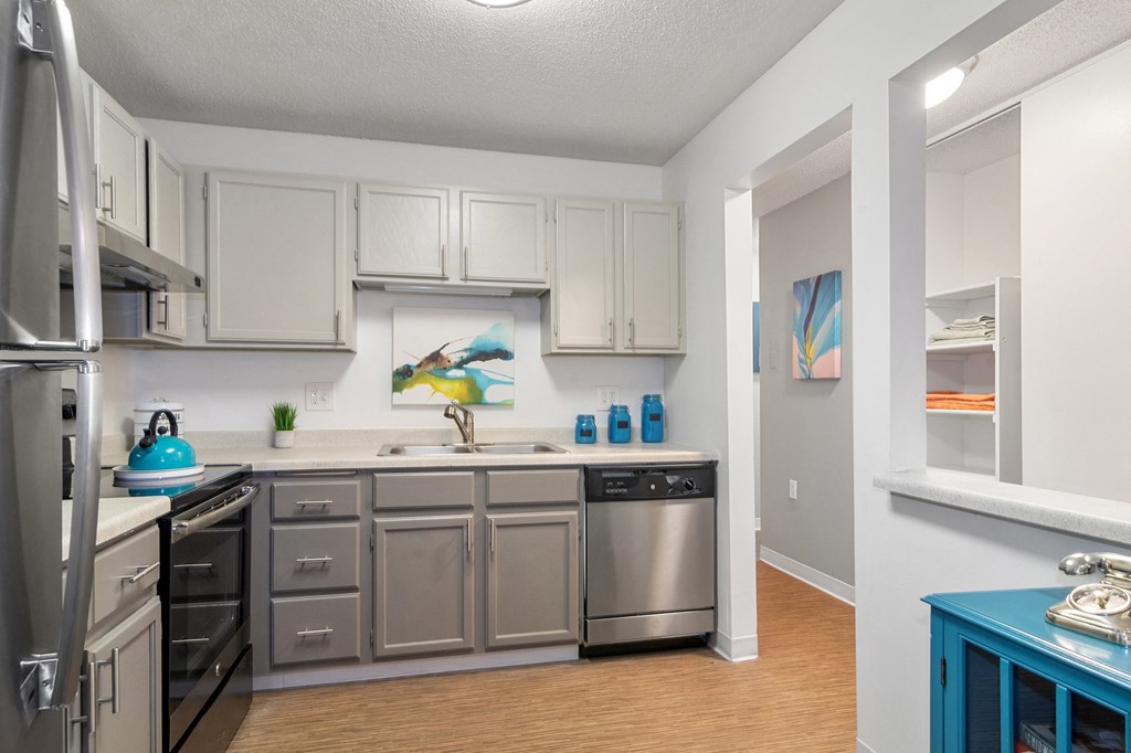 Kitchen with stainless steel appliances and white cabinets