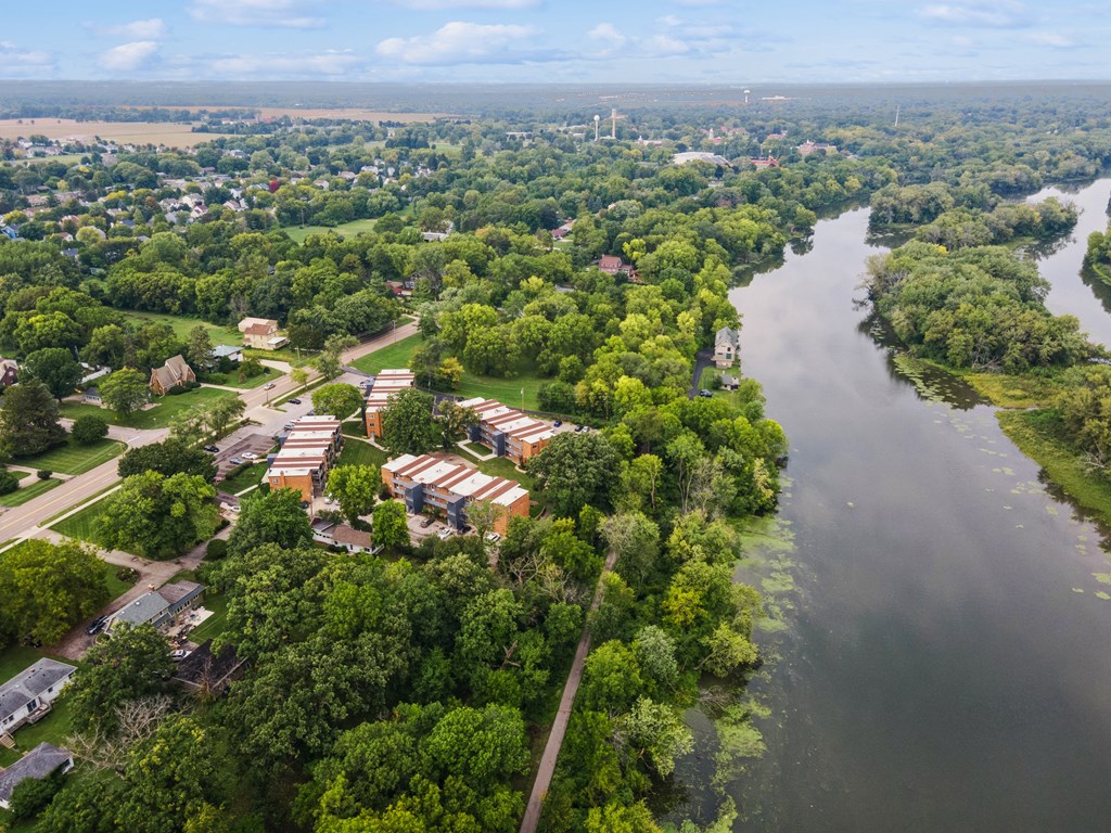 an aerial view of a neighborhood next to a river