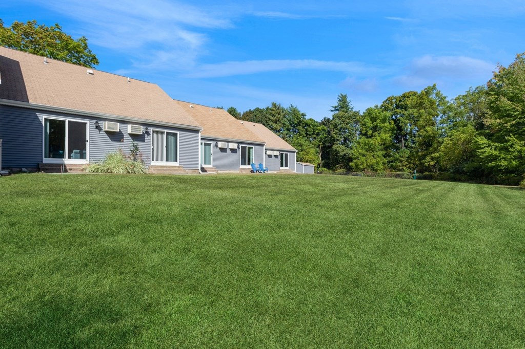 a large lawn in front of the apartments at Arbor Commons