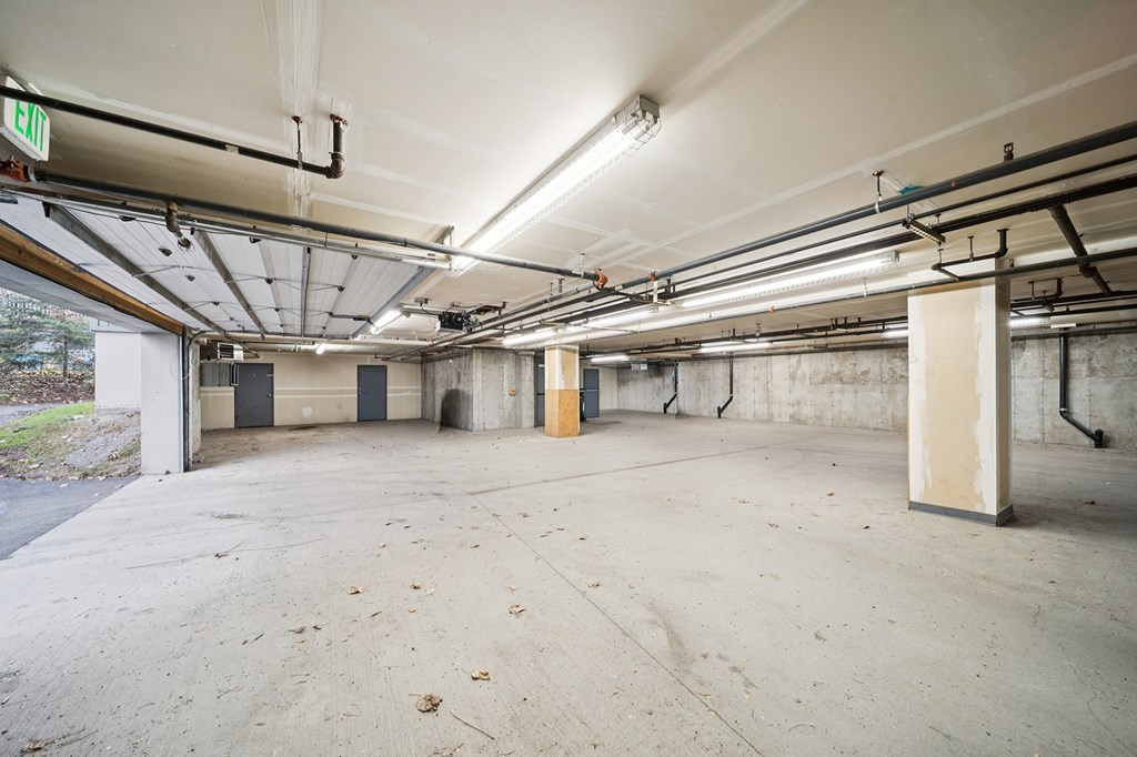 A large, empty parking garage with concrete floors and walls.