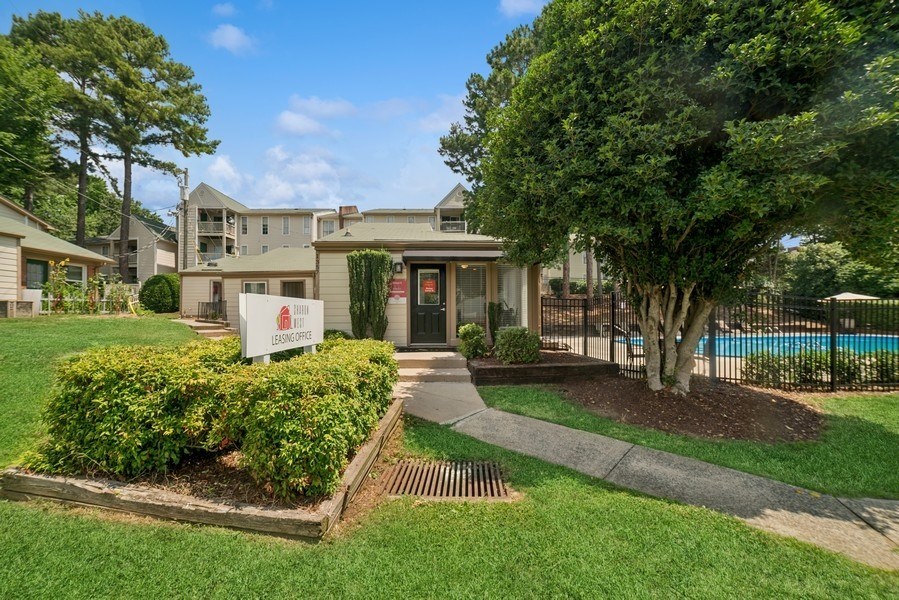 A building with a sign in front of it.