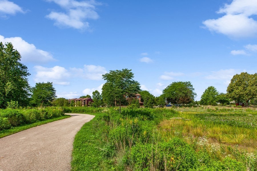 a path leading to a house in the distance