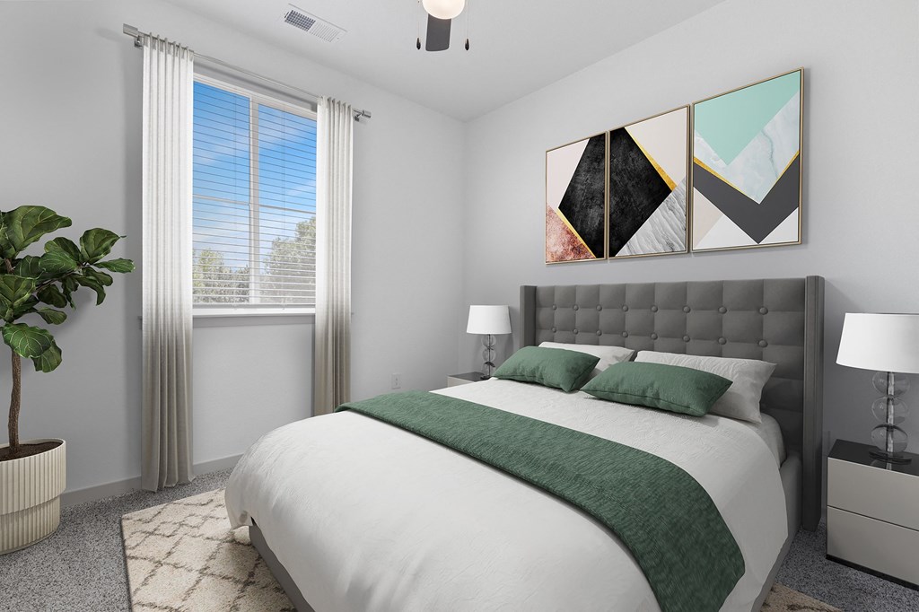 a bedroom with a white bed and green pillows