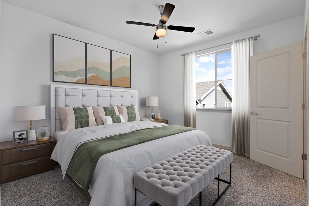 a bedroom with a large bed and a ceiling fan  at Arrive Longmont, Longmont, CO, 80504