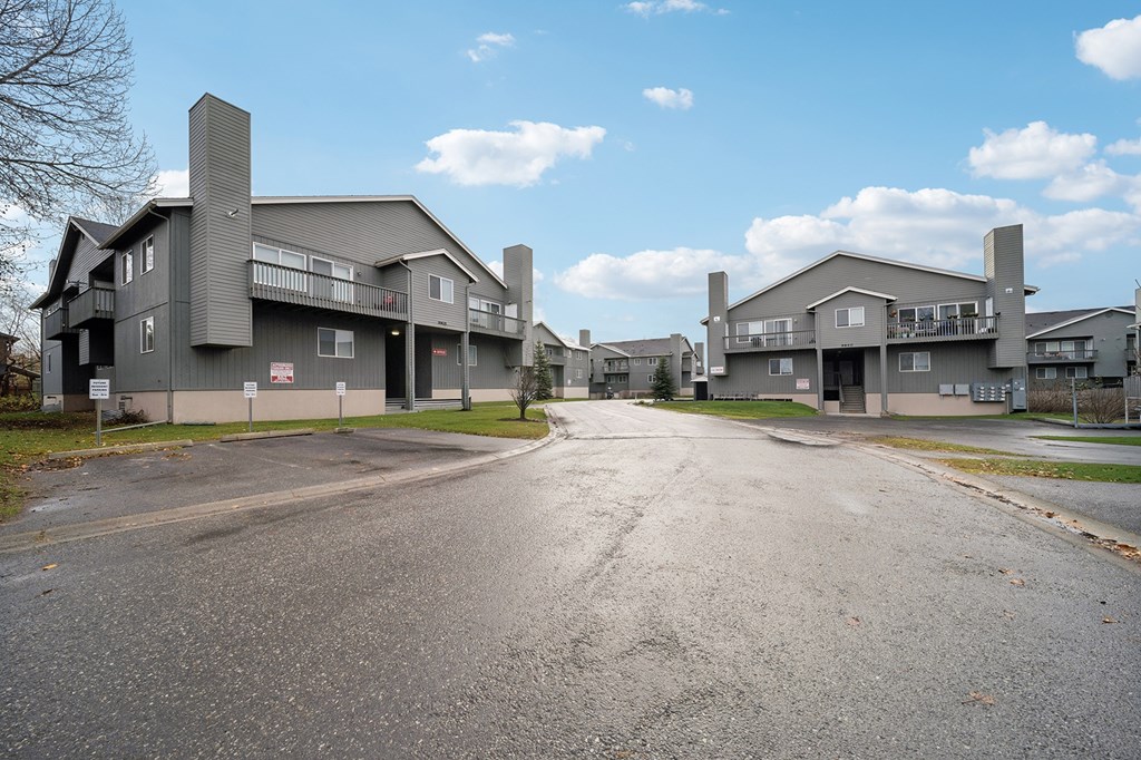 A road leads to a large building complex.