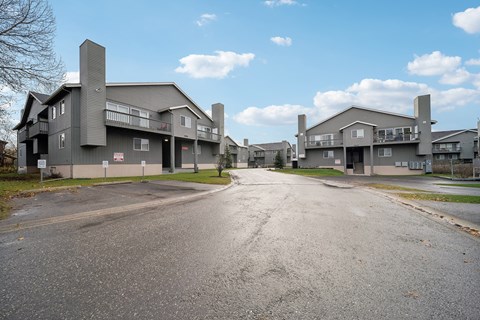 A road leads to a large building complex.