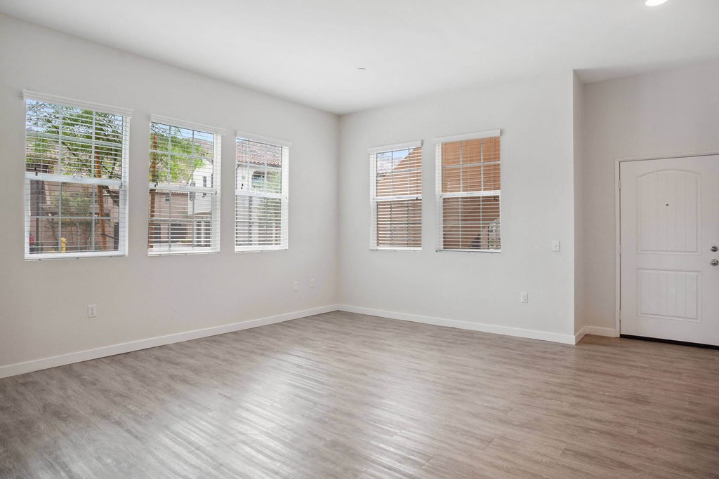 a bedroom with hardwood floors and white walls at Rancho Belago, Moreno Valley, CA