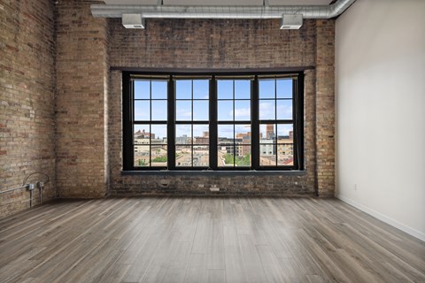 an empty room with a large windowat Gaar Scott Historic Lofts, Minnesota