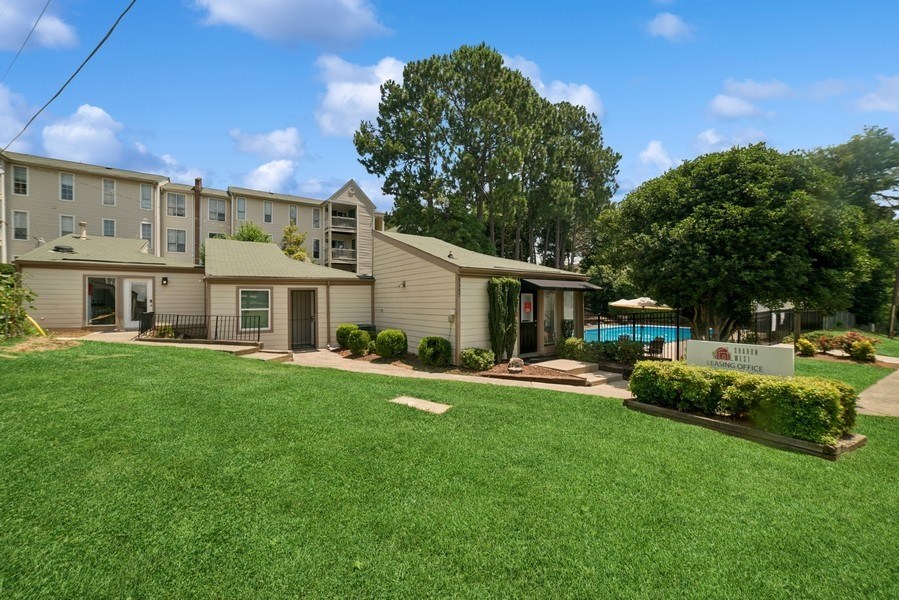 A sunny day at the apartment complex with a swimming pool.