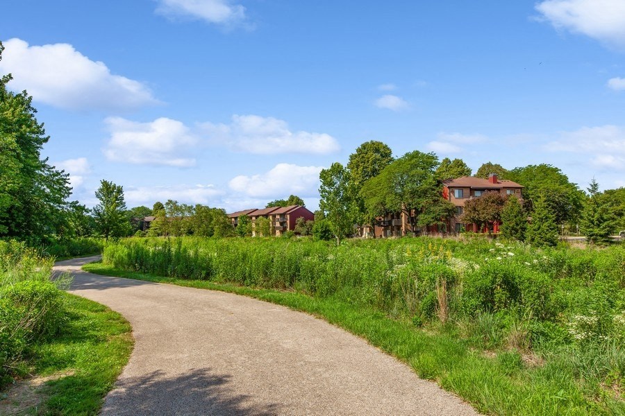 a path leading to a house in the distance