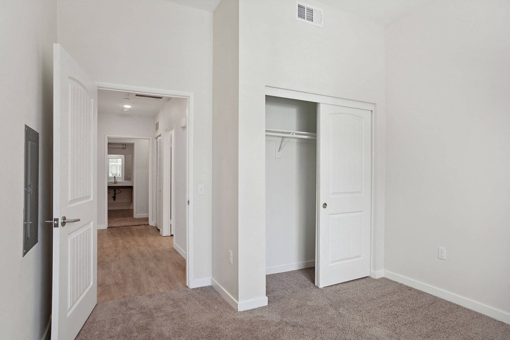 a bedroom with white walls and carpet at Rancho Belago, California, 92555