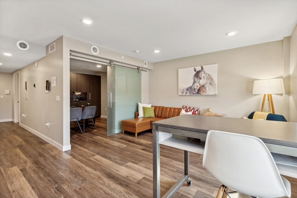 a living room and dining room with a table and chairs at The Rowe, Michigan