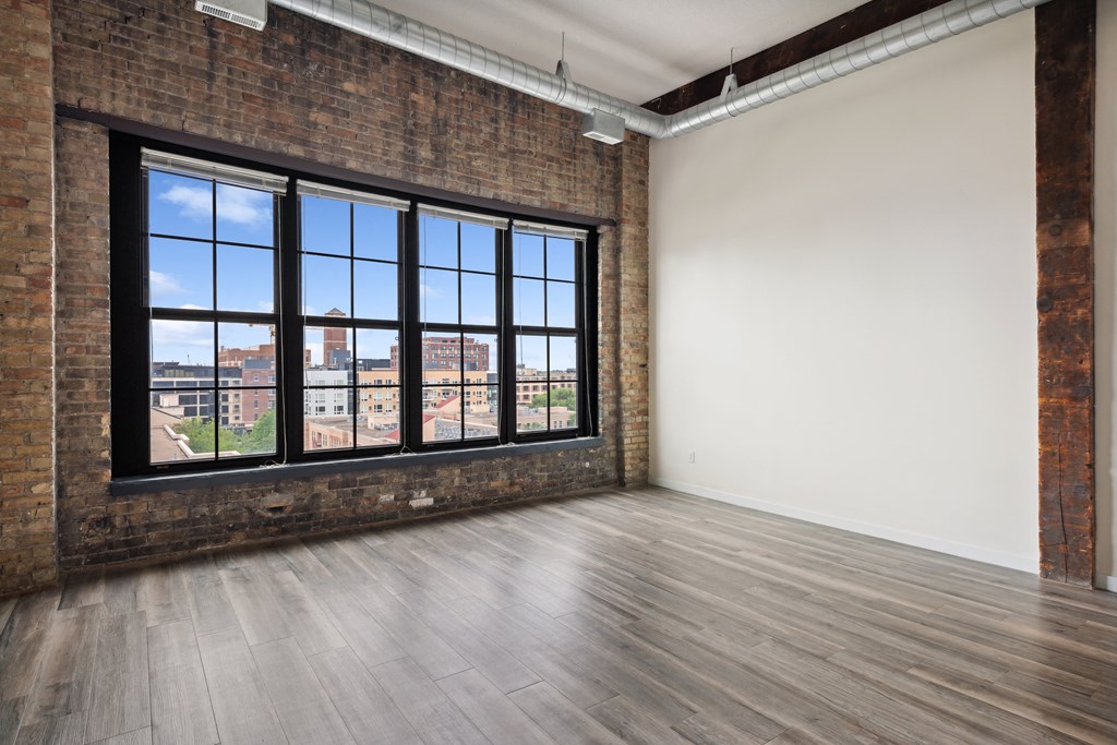 an empty room with a large windowat Gaar Scott Historic Lofts, Minnesota, 55401