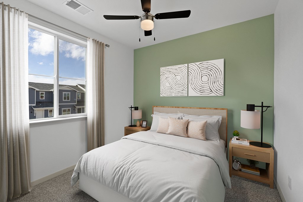 a bedroom with a bed and a ceiling fan at Arrive Longmont, Longmont, 80504
