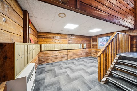 A wooden staircase with a wood railing.