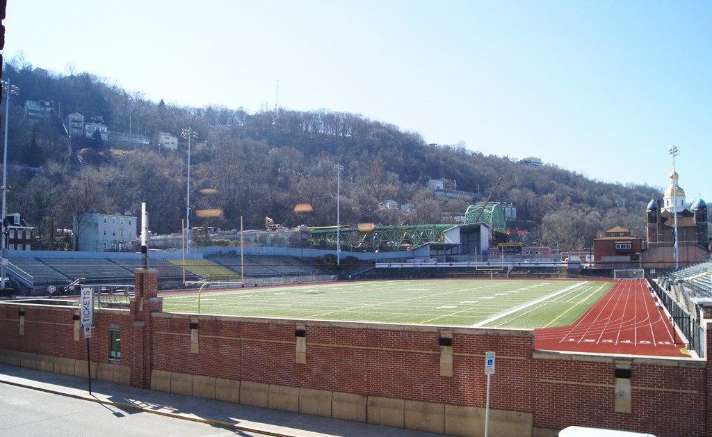 a view of the football field from the roof of a stadium