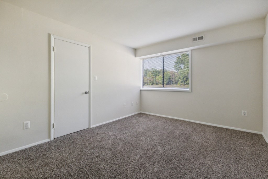 Bedroom with carpet and a window at Briarwood Apartments, Dumfries, VA, 22026
