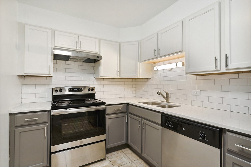 a kitchen with white cabinets at The Hinsdale, Hinsdale, IL, 60521