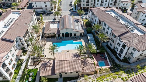 A bird's eye view of a resort with a swimming pool.