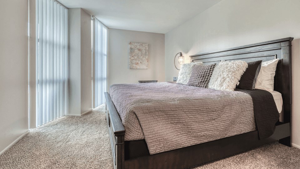 a bedroom with a bed and a window at St. Charles, St. Charles, IL