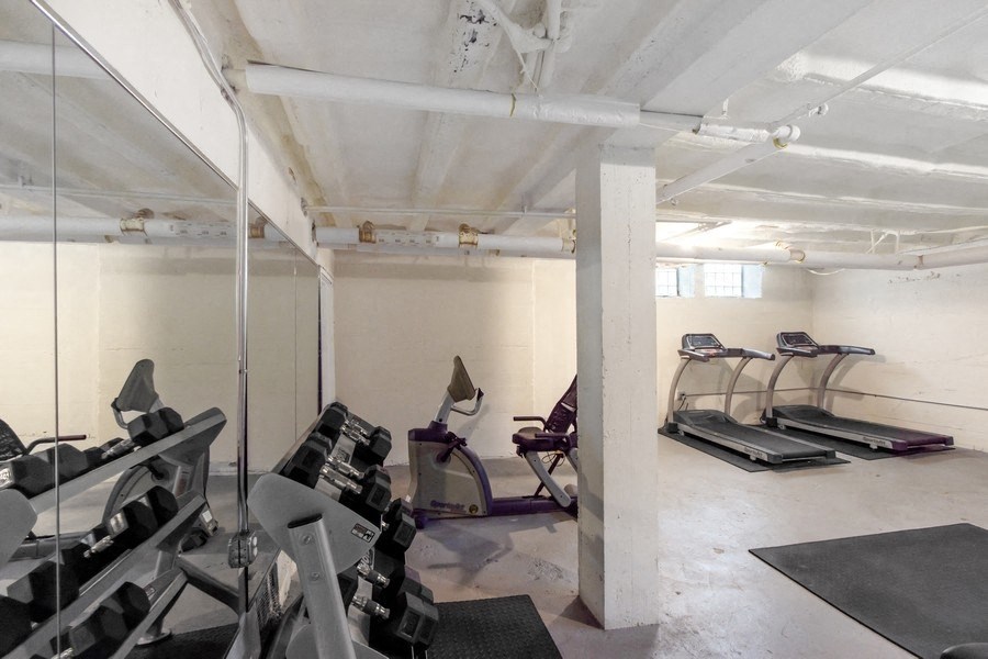 a gym with treadmills and other exercise equipment