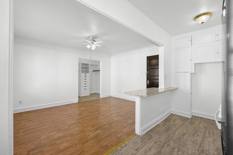 A room with wooden floors and white walls at Pleasant Oak Apartments, Illinois