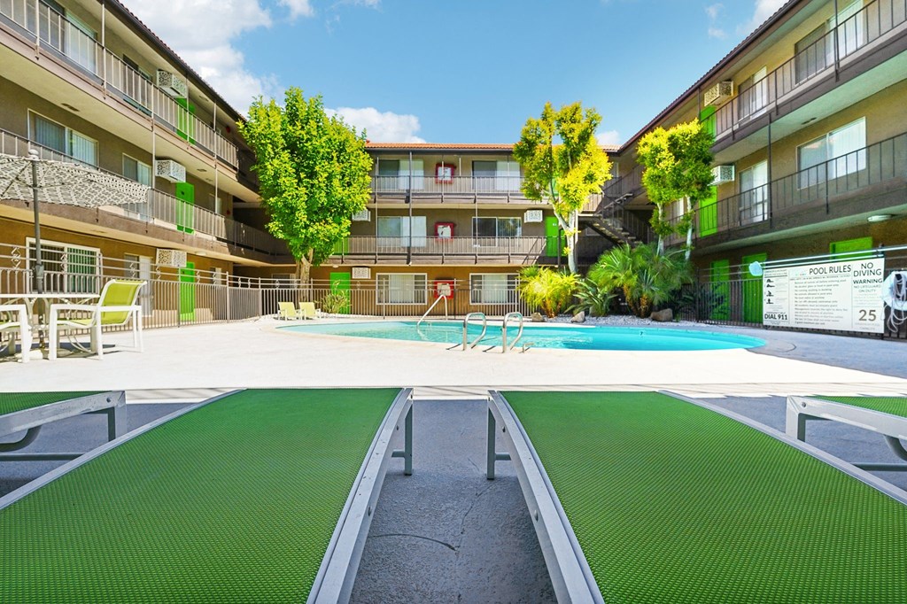 a swimming pool in the middle of an apartment building