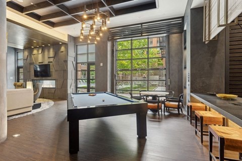 a pool table in the middle of a living room