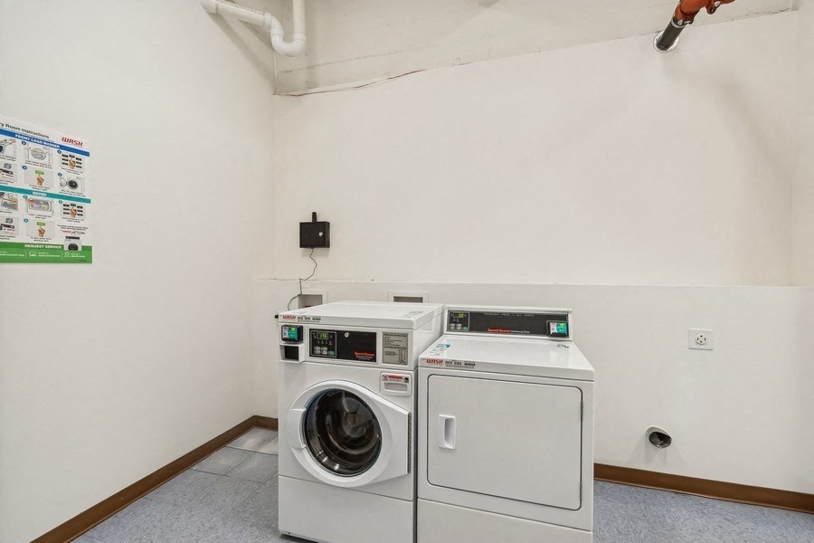 a laundry room with a washing machine and a dryer