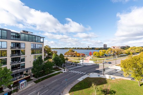 Waterfront view with lakeside park and crosswalk at 1800 Lake Apartments, Minneapolis, MN 55408