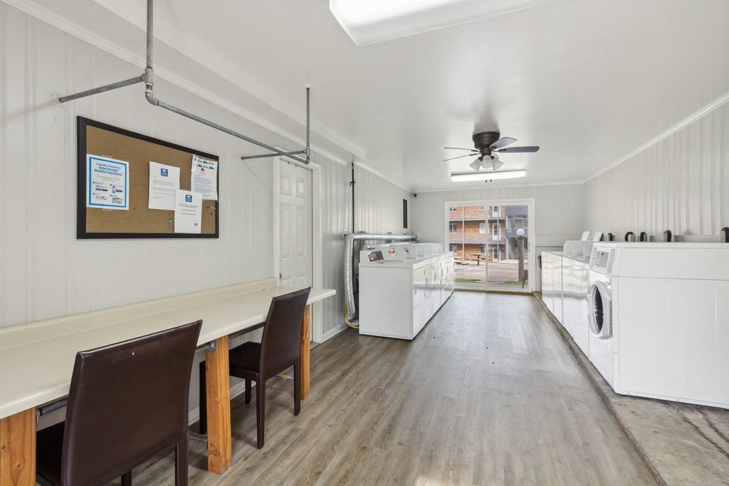 a kitchen and dining room with white appliances and a ceiling fan at River Oaks, North Aurora, Illinois