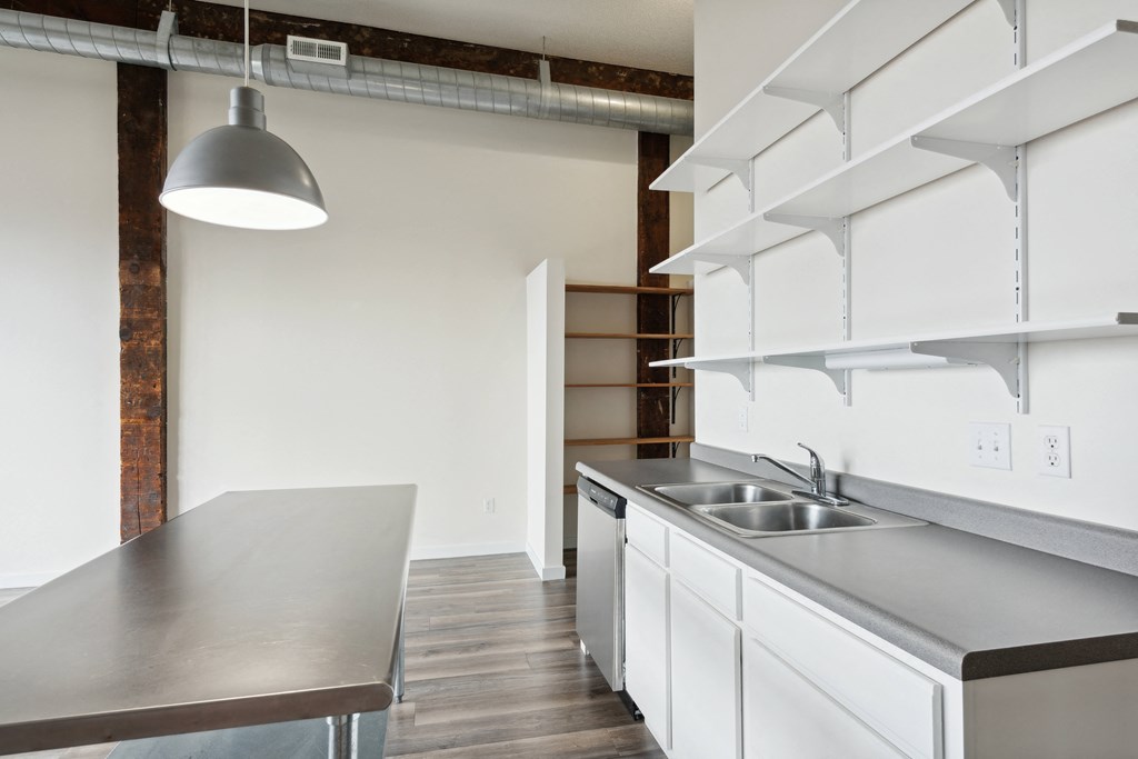 a kitchen and dining area in a 555 waverly unitat Gaar Scott Historic Lofts, Minnesota