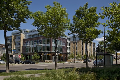 A street view of a building with a sign that reads