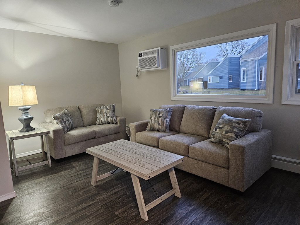 a living room with a couch and a table at The Flats at Talcott, Weatogue, Connecticut, 06089