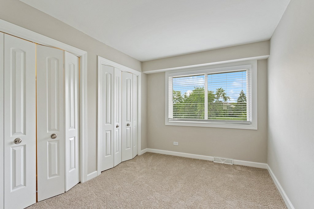 a bedroom with a window at The Hinsdale, Hinsdale, IL, 60521